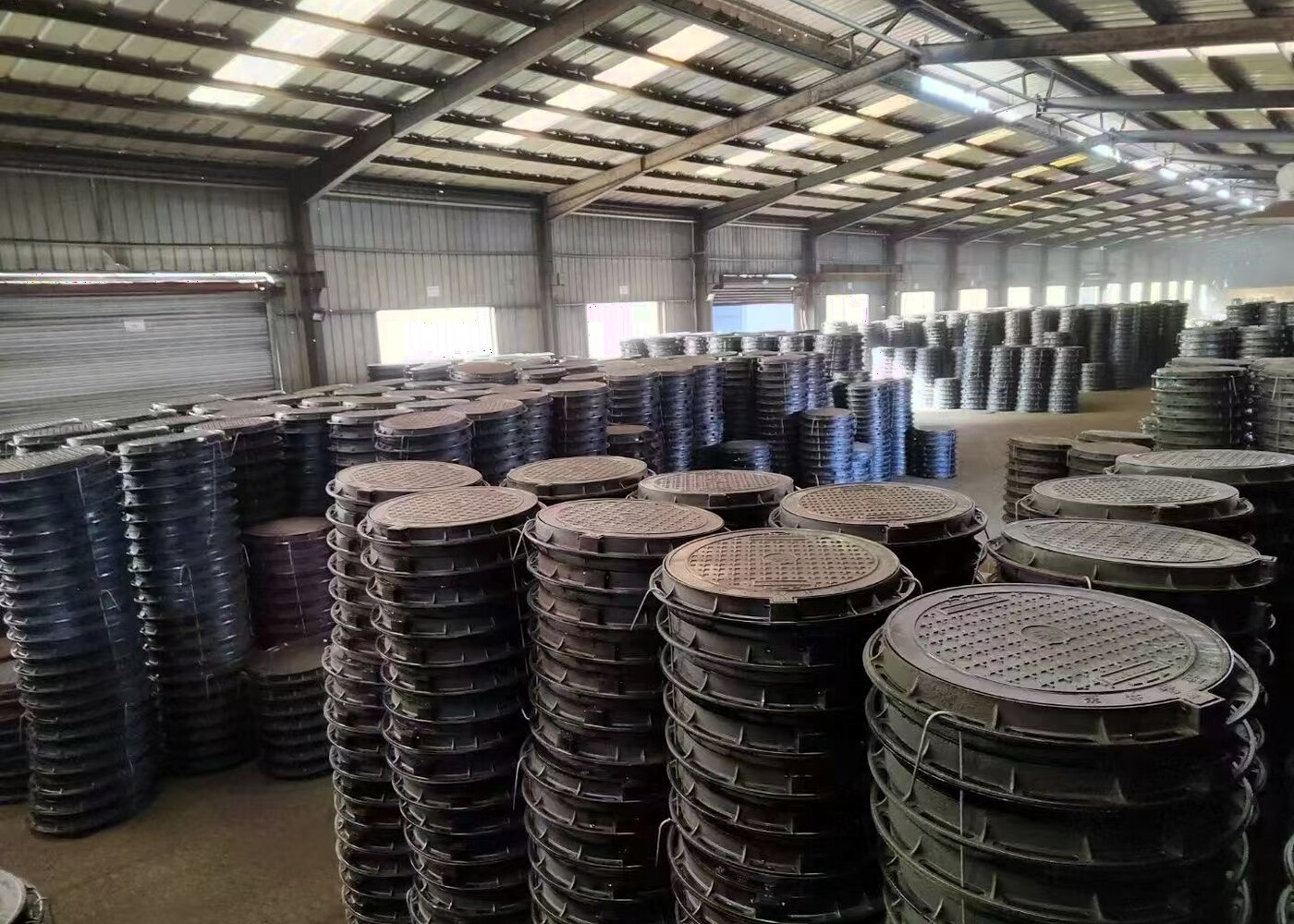 Ductile iron manhole covers in warehouse stacks